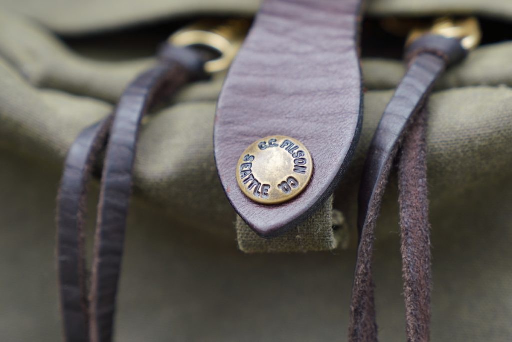 filson journeyman backpack snap closure