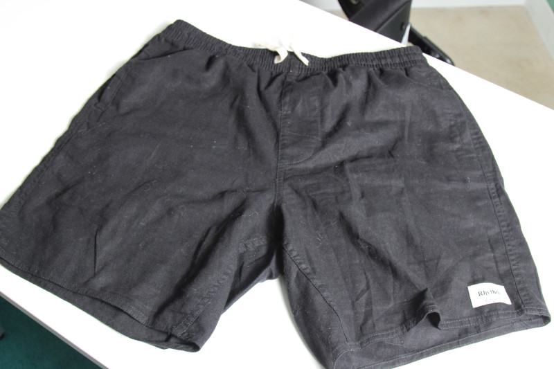 Rythm Classic Jam Black Shorts on a table