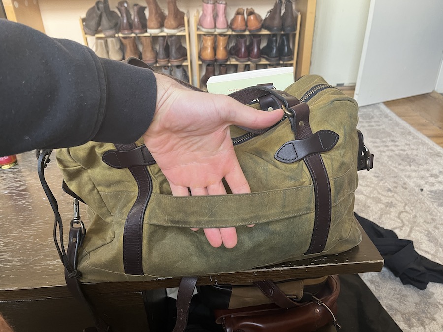filson 48hr tin cloth duffle rolling luggage attachment