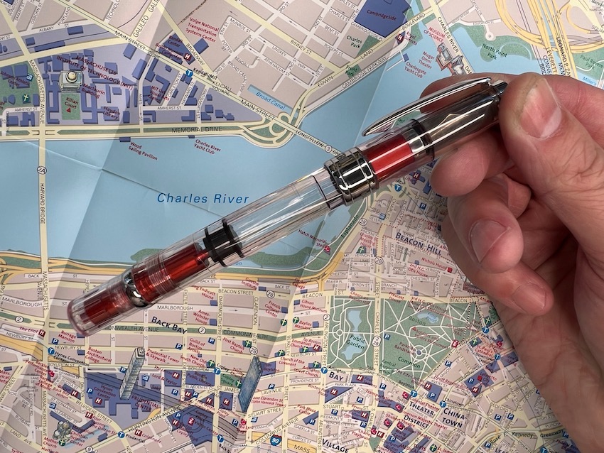 TWSBI Diamond 580 fountain pen internal piston fill pen demonstrator with red accents.