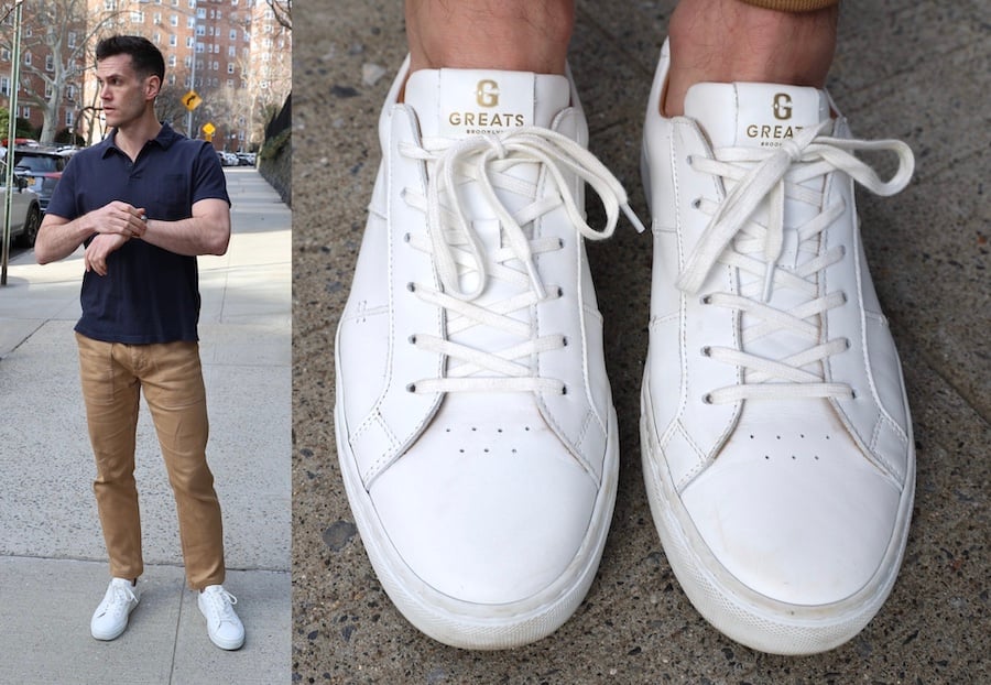 a man wearing white sneakers with polo shirt