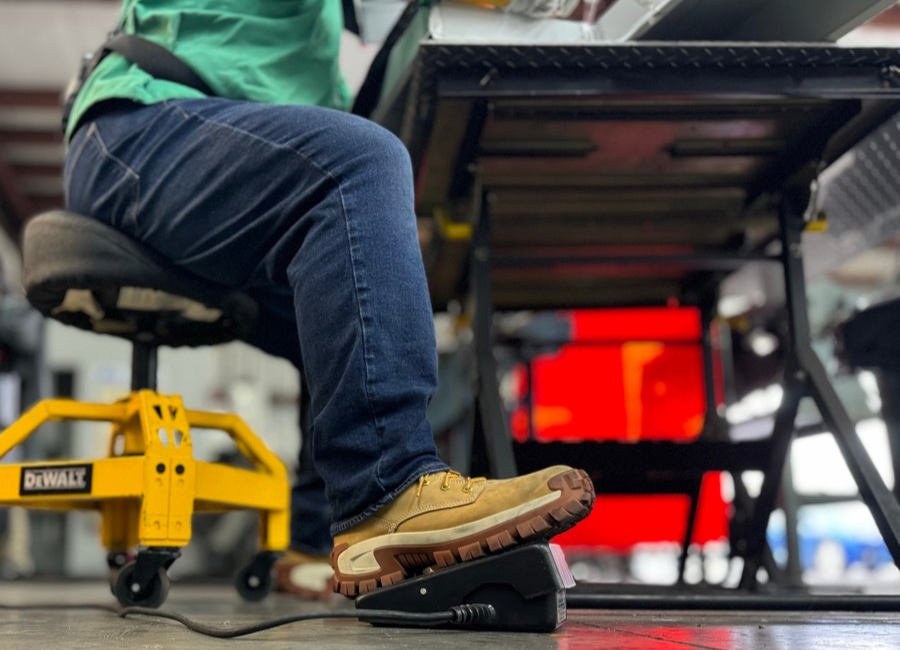CAT Invader on foot while fabricating sheet metal