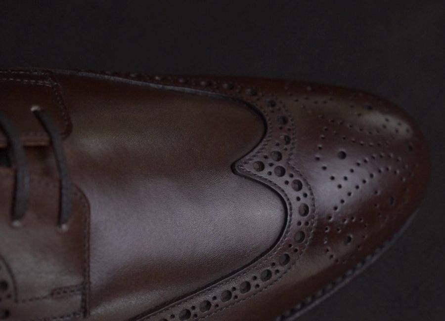 close up of broguing on wing tips