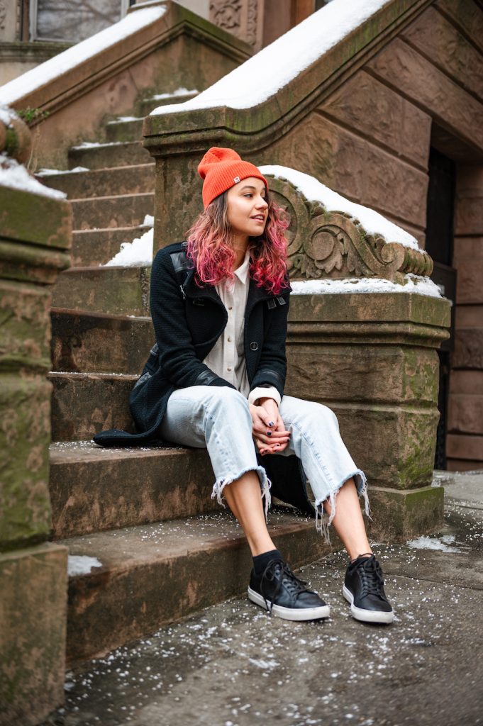 a woman in brooklyn wearing streetwear and sneakers