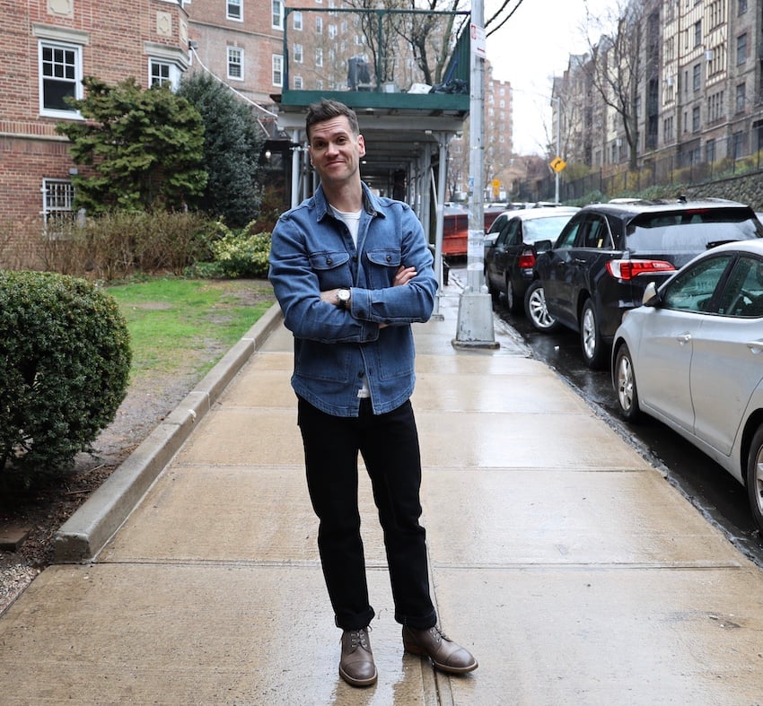 Nick in Iron boots on rainy street, full body shot