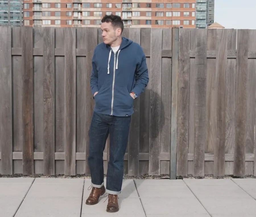 nick wearing Iron rangers and a hoodie