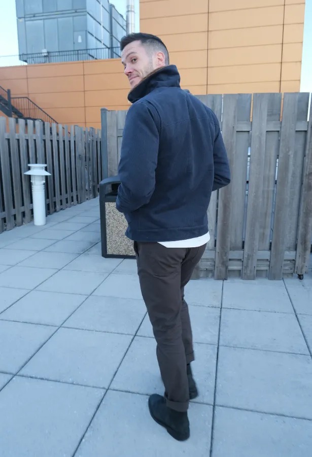 Nick in canvas pants from behind